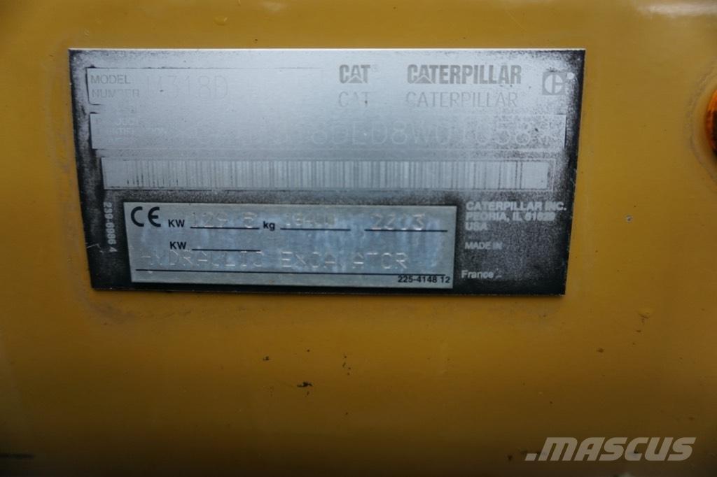 CAT M 318 D حفارات بعجل