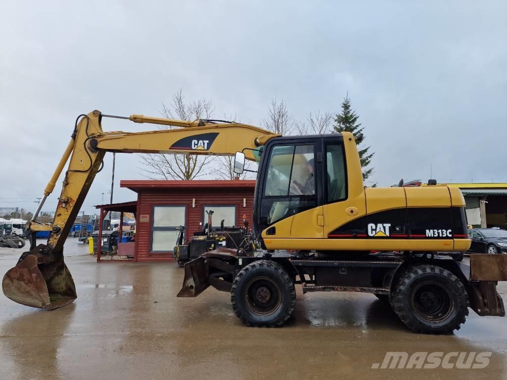 CAT M 313 C حفارات بعجل