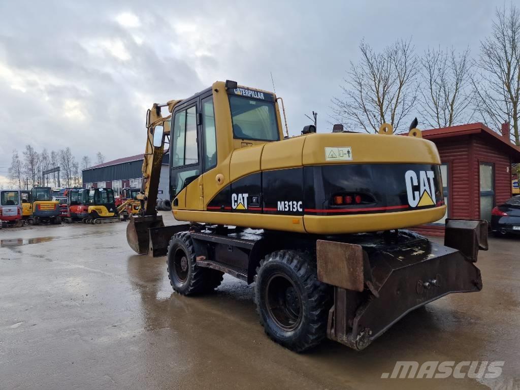 CAT M 313 C حفارات بعجل
