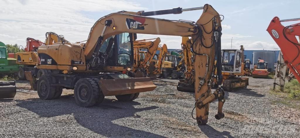 CAT M 315 D حفارات بعجل