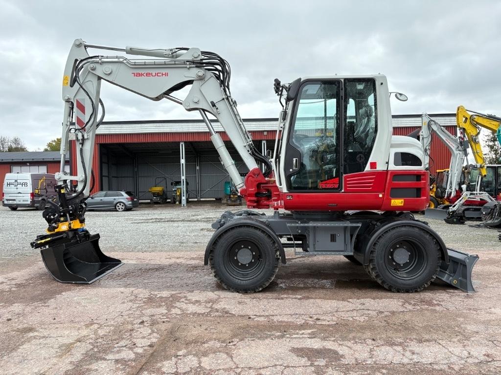 Takeuchi TB395W حفارات بعجل