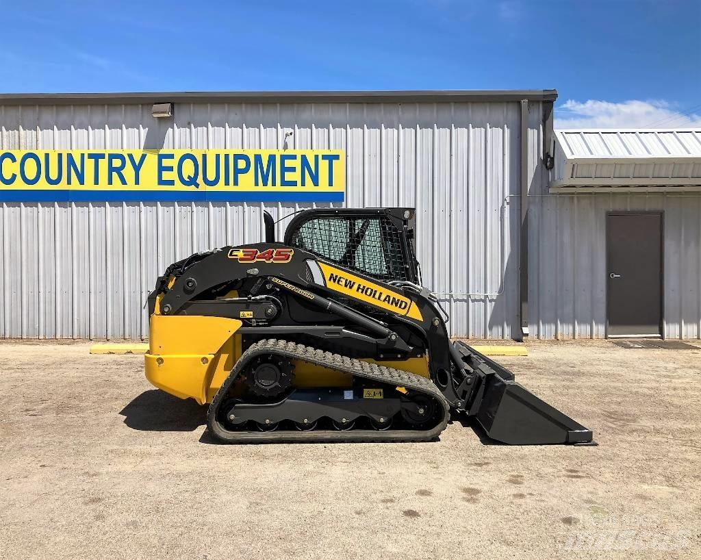 New Holland C 345 لوادر انزلاقية التوجيه