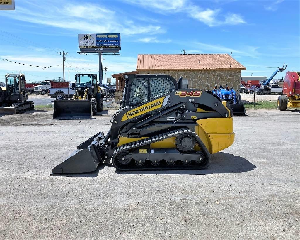 New Holland C 345 لوادر انزلاقية التوجيه