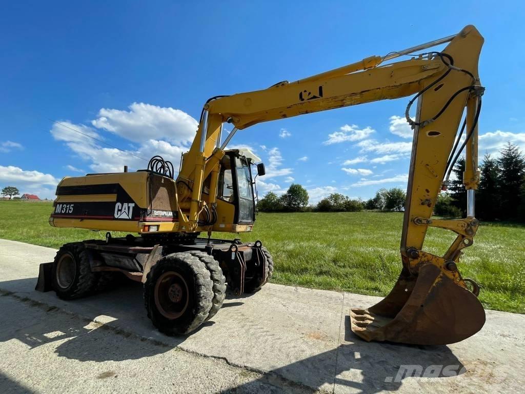 CAT M 315 حفارات بعجل