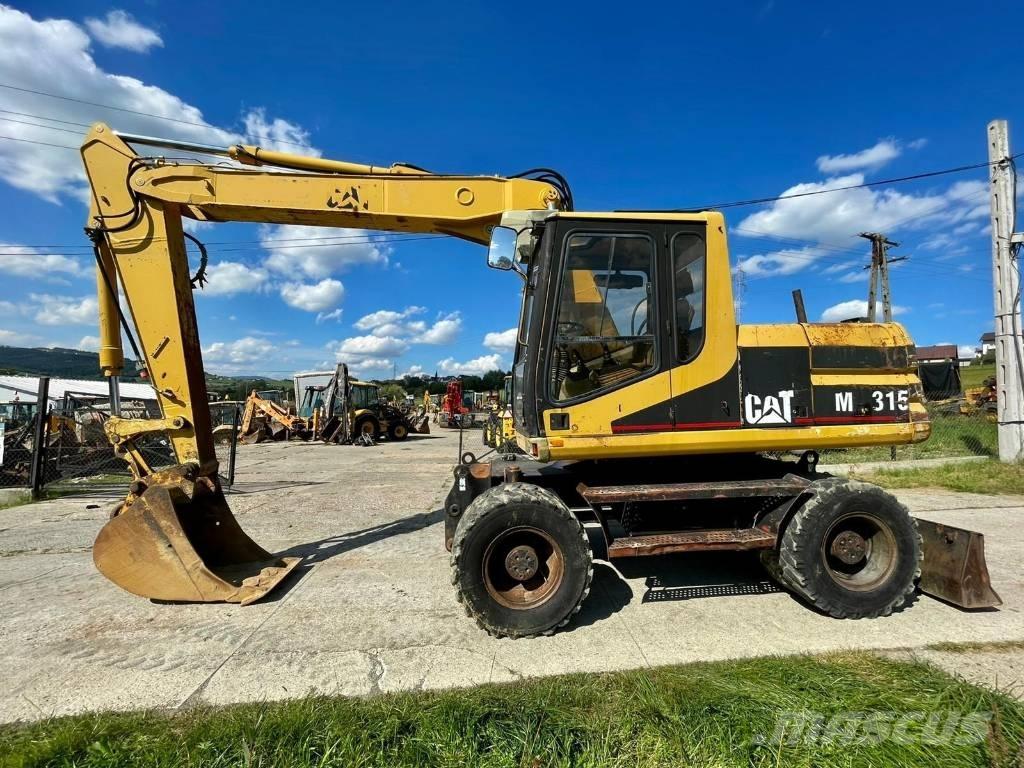CAT M 315 حفارات بعجل