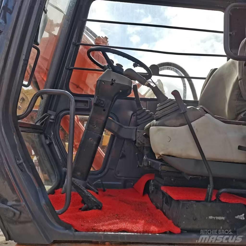 Hitachi EX 100 W D حفارات بعجل
