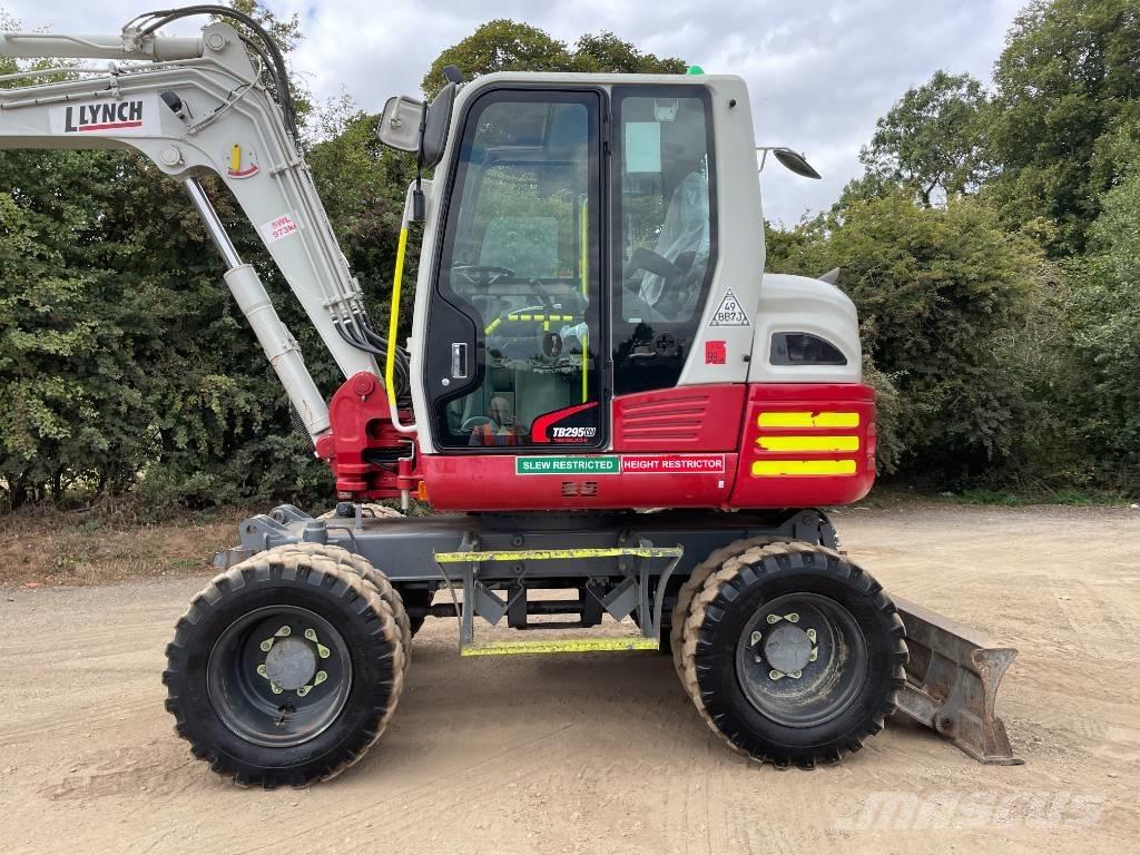 Takeuchi TB 295 W حفارات بعجل