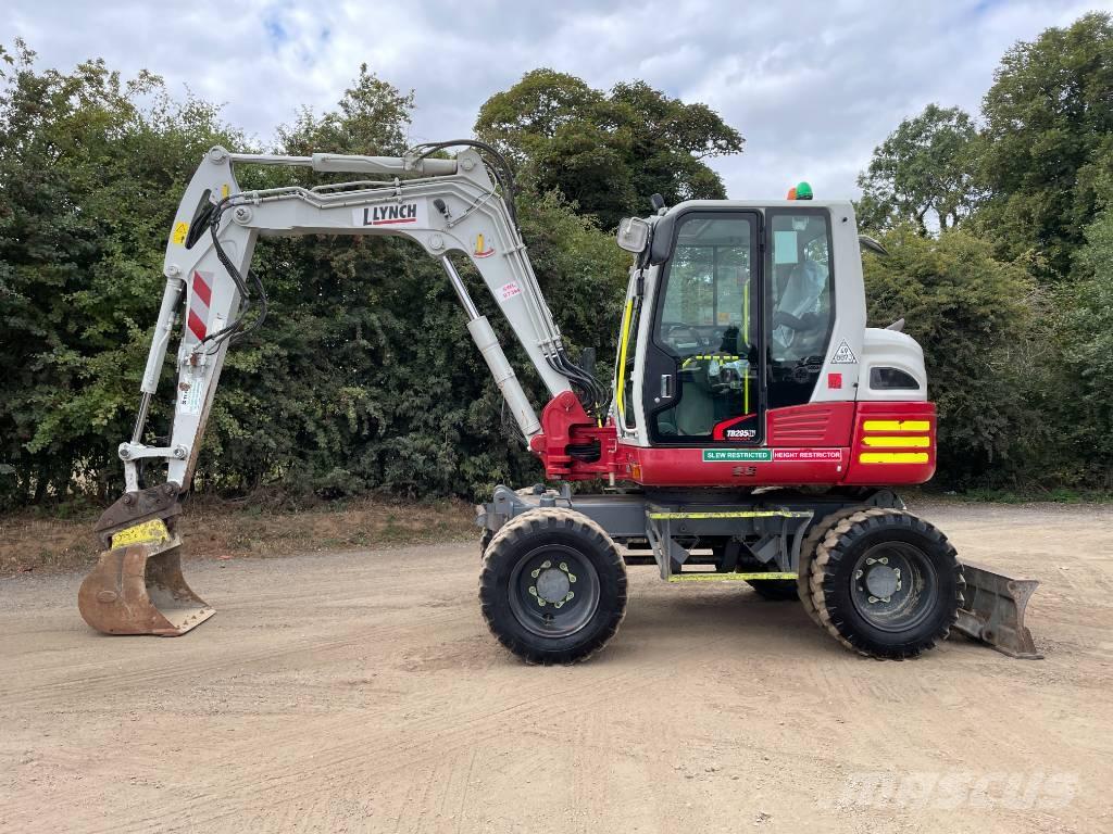 Takeuchi TB 295 W حفارات بعجل