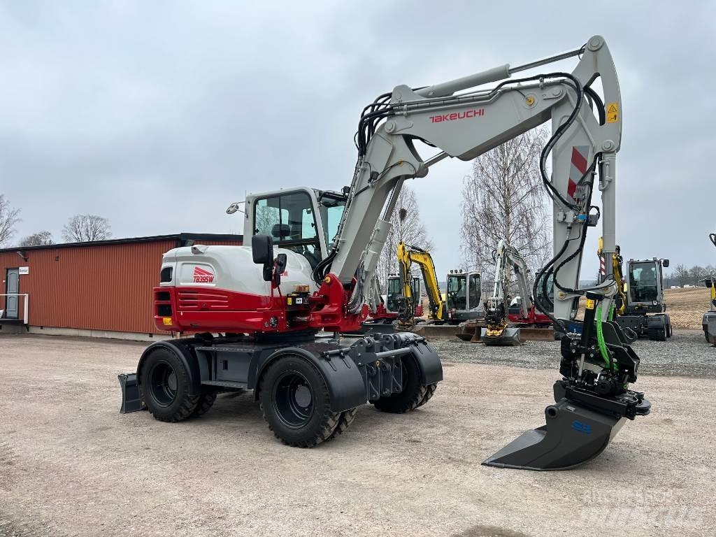 Takeuchi TB395W حفارات بعجل