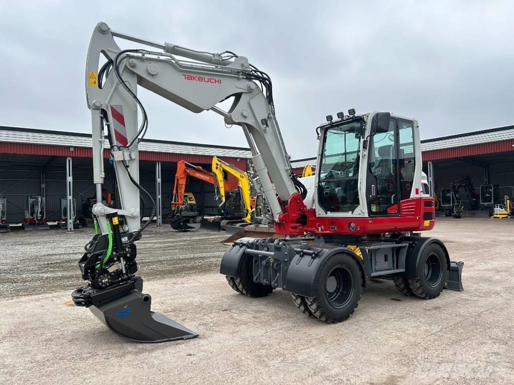 Takeuchi TB395W حفارات بعجل