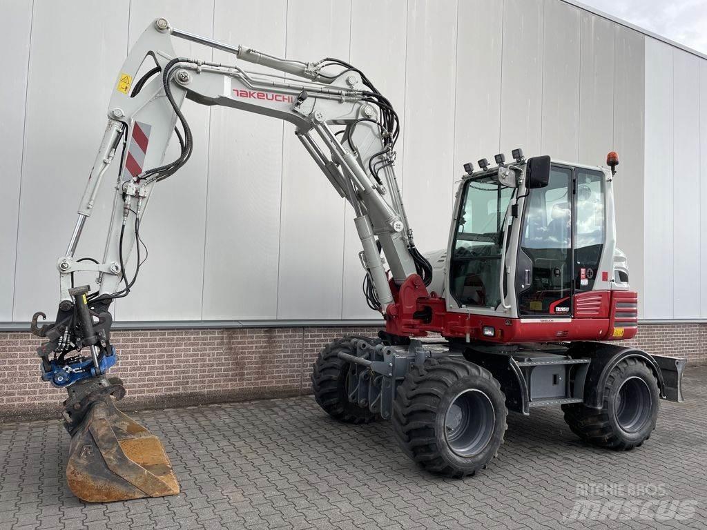 Takeuchi TB295W حفارات بعجل