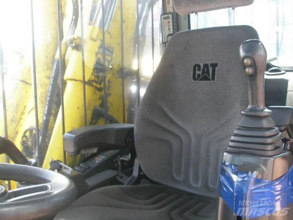 CAT M318F حفارات بعجل