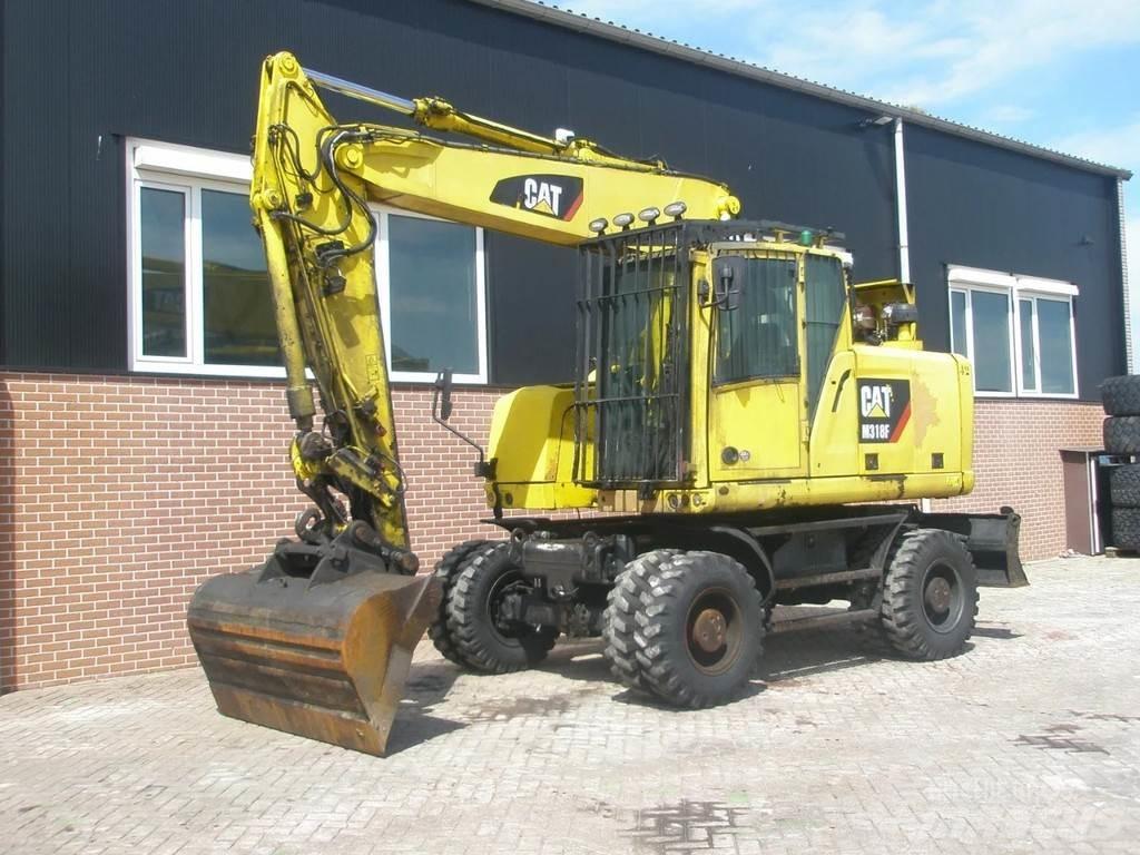 CAT M318F حفارات بعجل