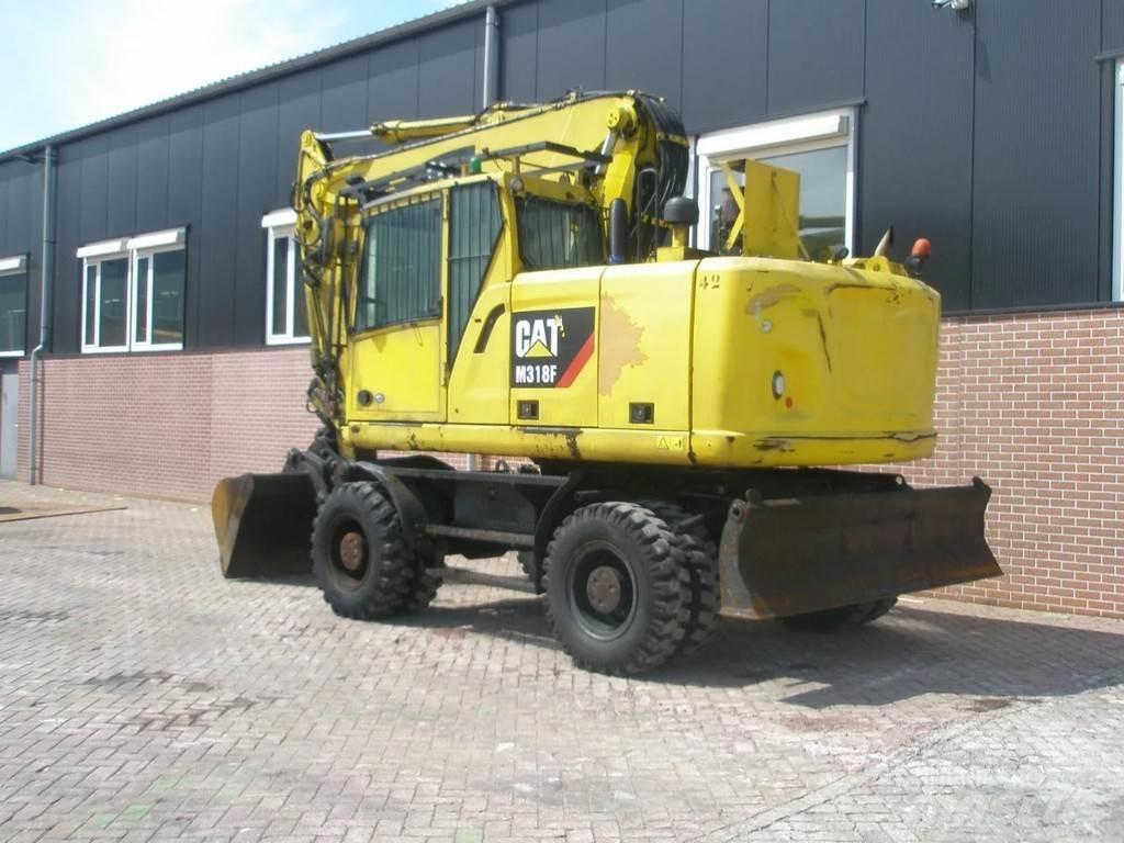 CAT M318F حفارات بعجل