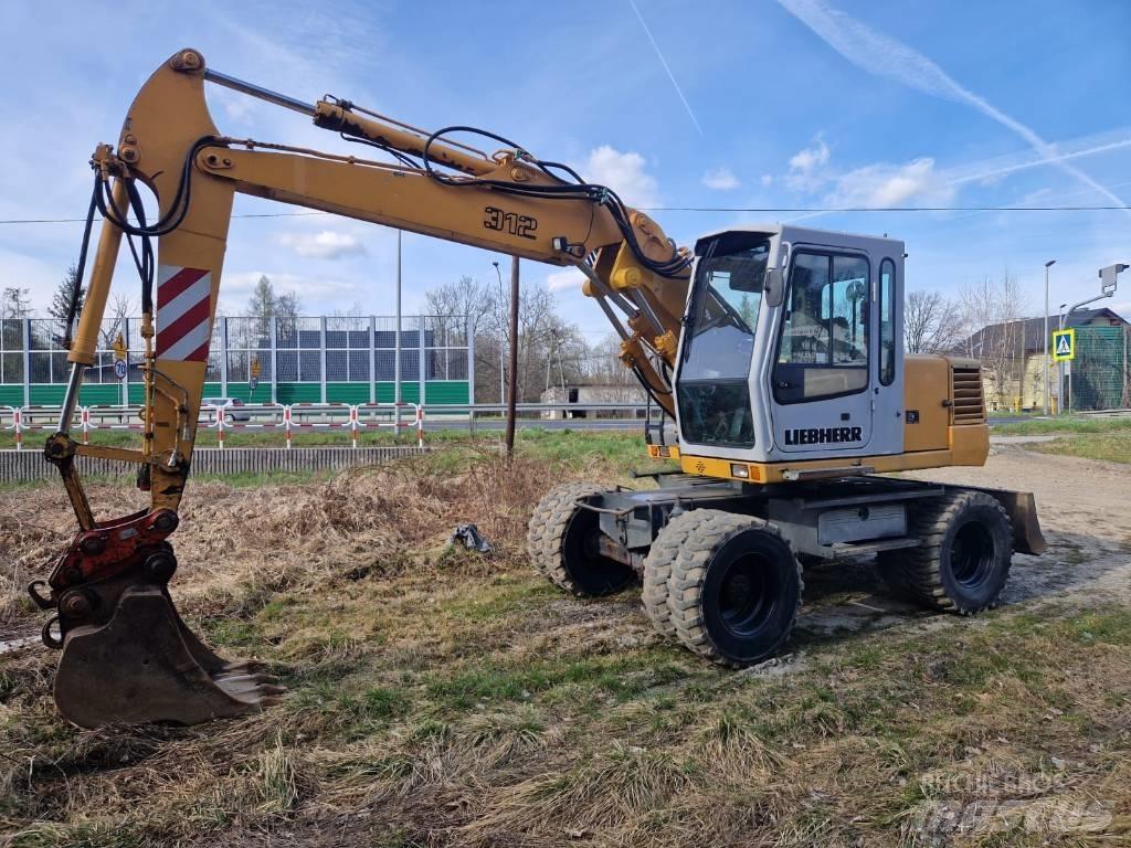Liebherr 312 A حفارات بعجل
