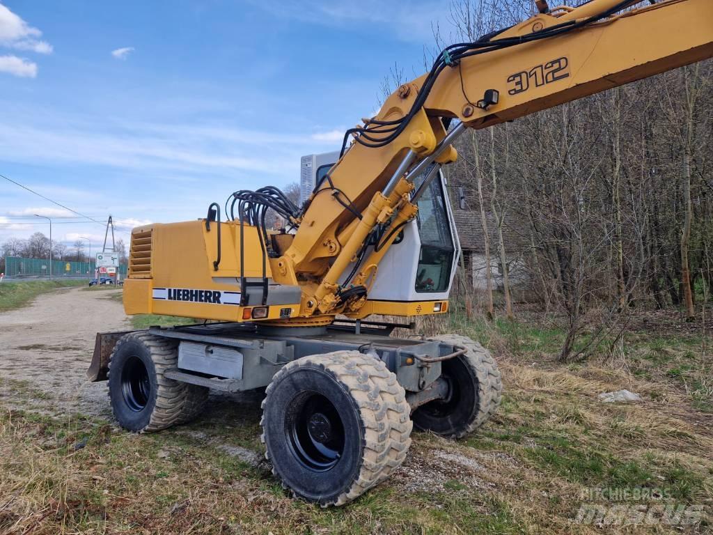Liebherr 312 A حفارات بعجل