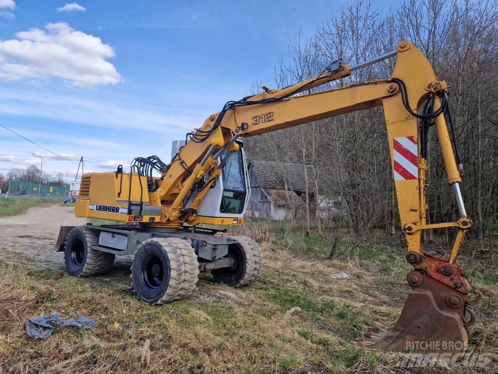 Liebherr 312 A حفارات بعجل