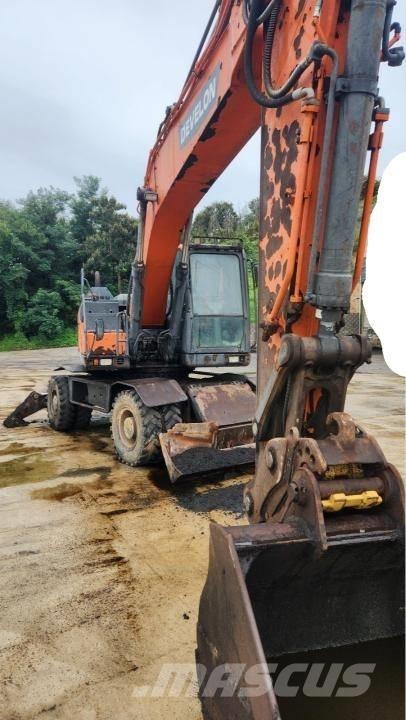 Doosan DX 210 W حفارات بعجل