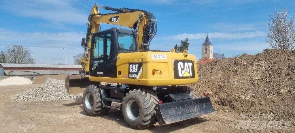 CAT M 313 D حفارات بعجل