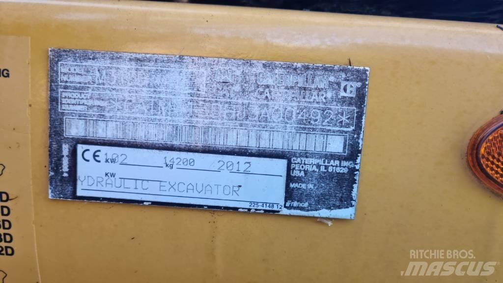 CAT M 313 D حفارات بعجل