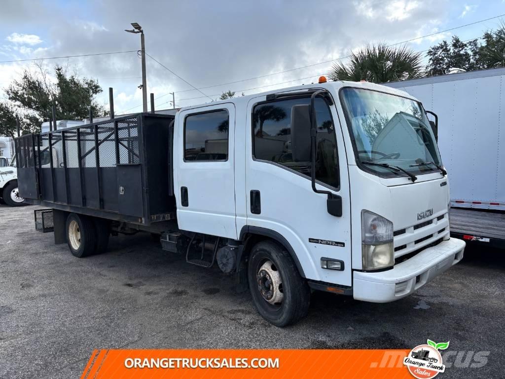 Isuzu NPR شاحنات مسطحة/مفصلية الجوانب