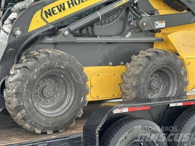 New Holland L 228 لوادر انزلاقية التوجيه