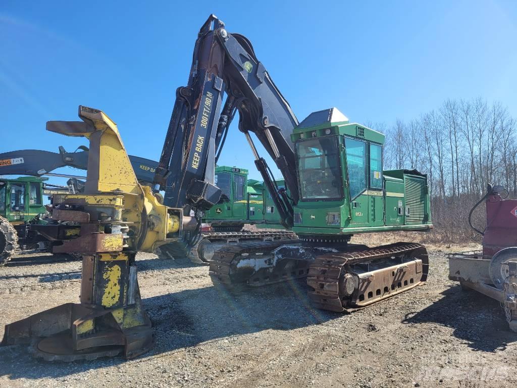John Deere 853 قاطعات وجامعات الأشجار