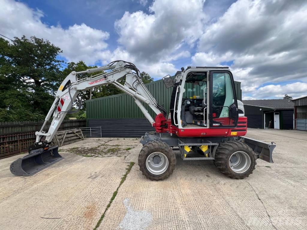 Takeuchi 295w حفارات بعجل