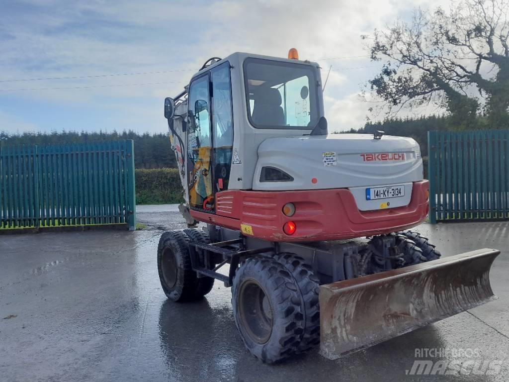 Takeuchi TB 295 W حفارات بعجل