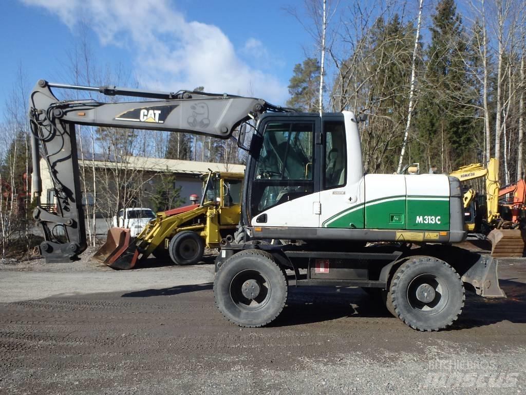 CAT M 313 C 4x4 حفارات بعجل