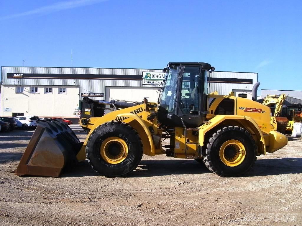 New Holland W 230 C لوادر بعجل
