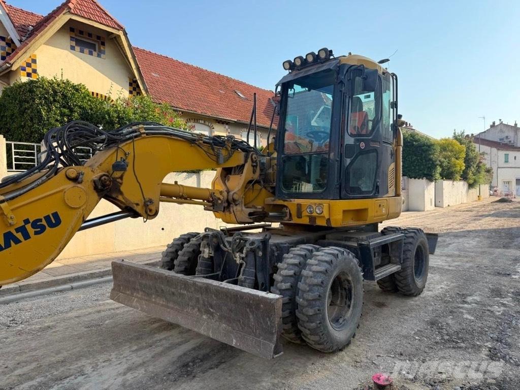 Komatsu PW 118 حفارات بعجل