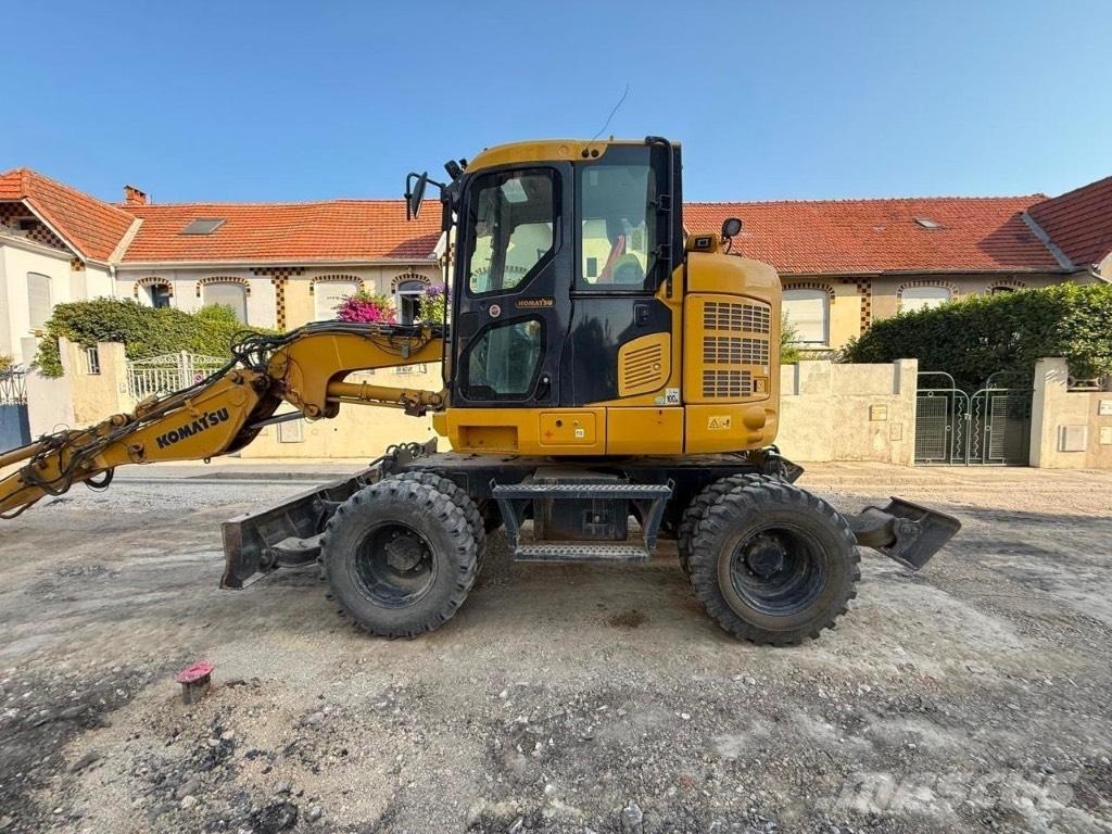 Komatsu PW 118 حفارات بعجل