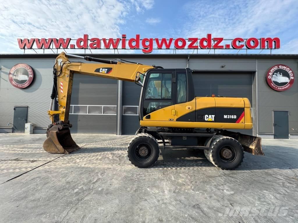 CAT M 316 D حفارات بعجل