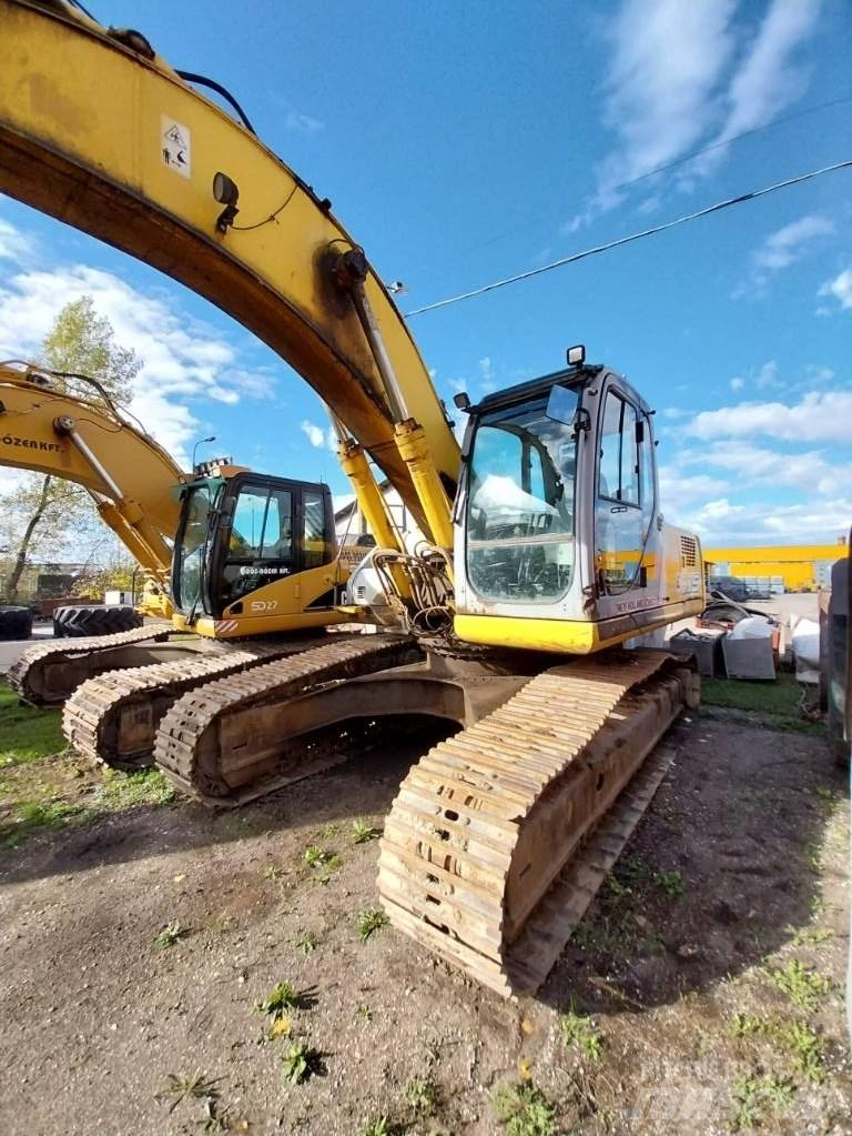 New Holland E 305 حفارات زحافة
