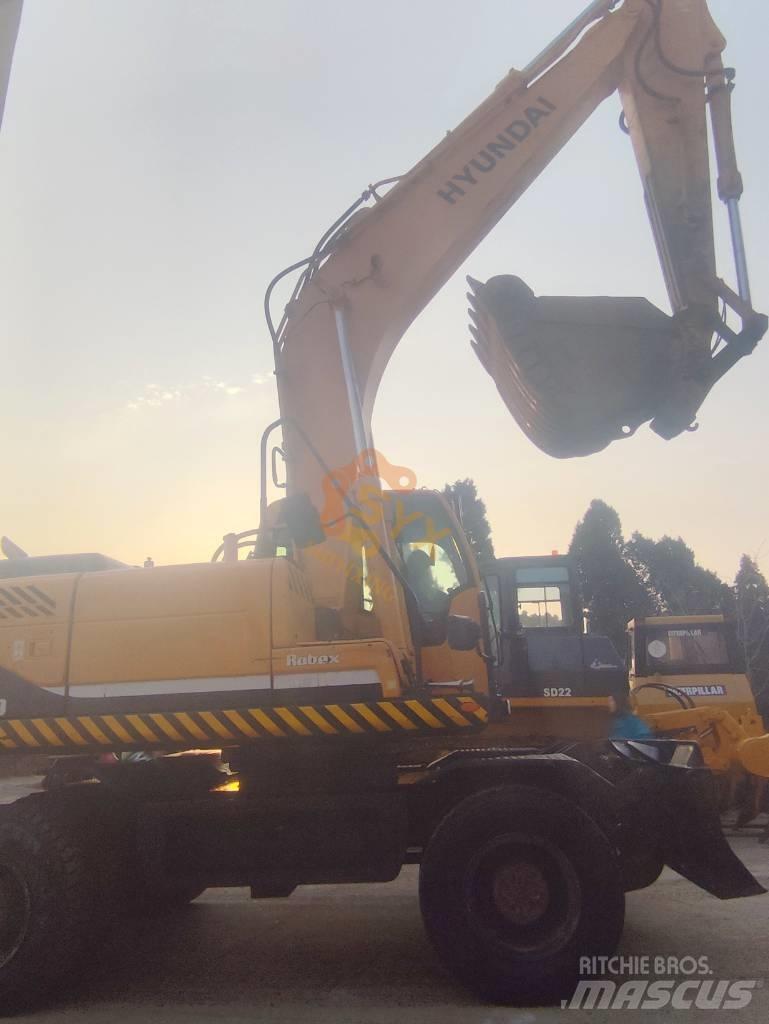Hyundai 210W-9 حفارات بعجل