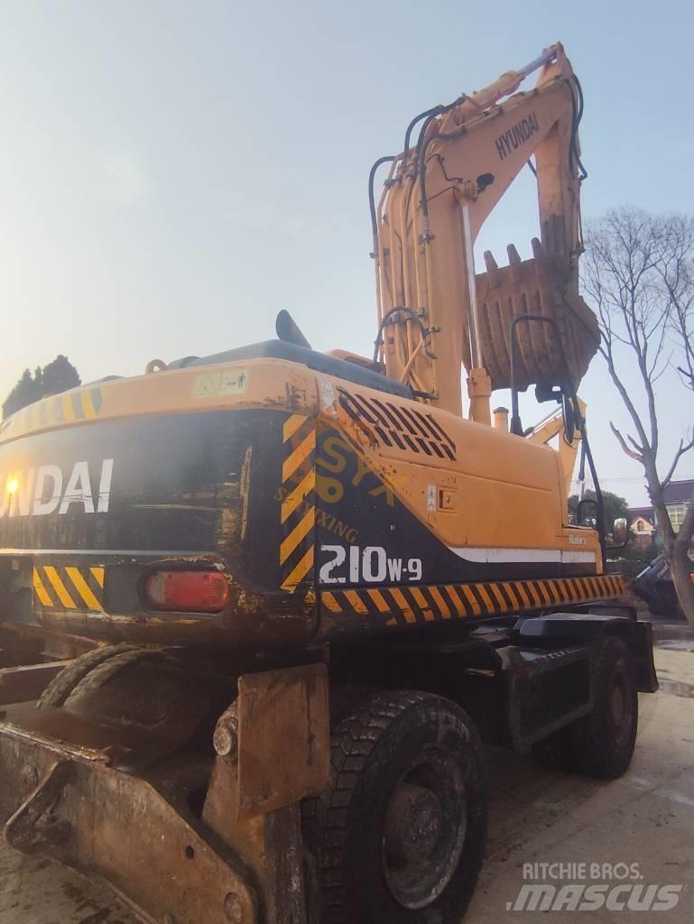 Hyundai 210W-9 حفارات بعجل