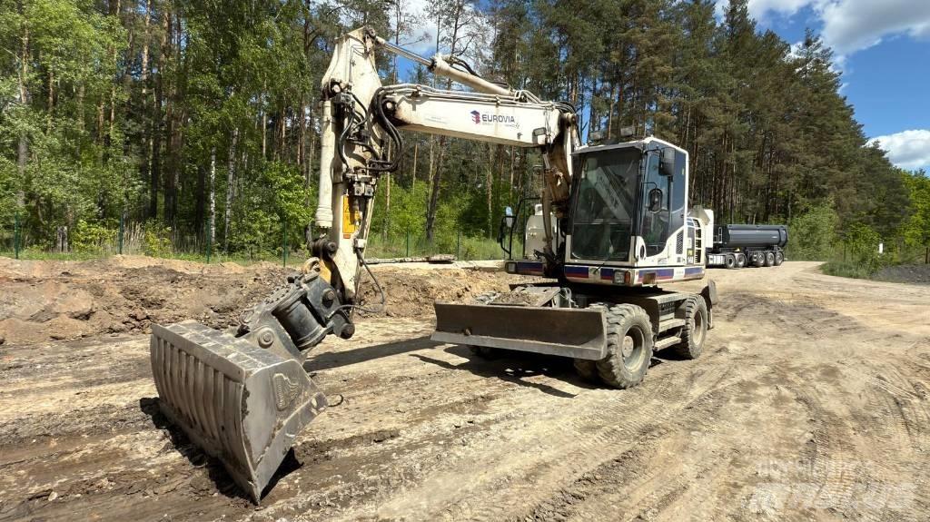 Komatsu PW 148-8 حفارات بعجل