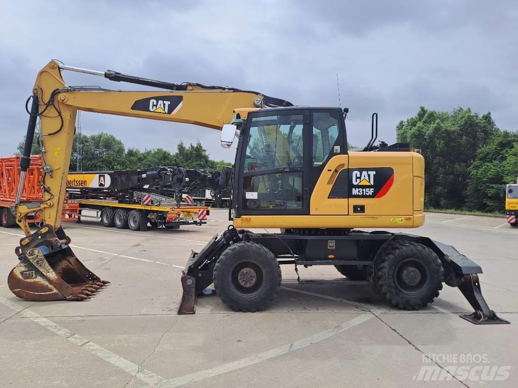 CAT M315F حفارات بعجل