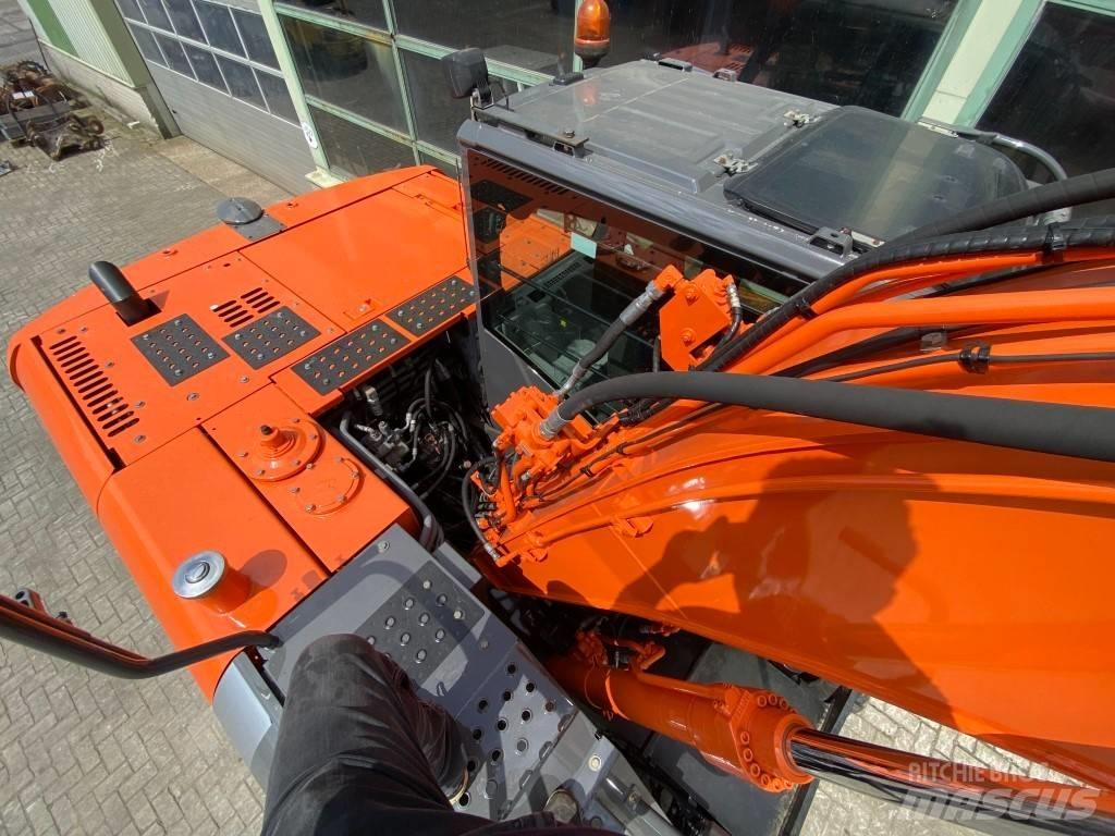 Hitachi ZX 140 W-3 حفارات بعجل