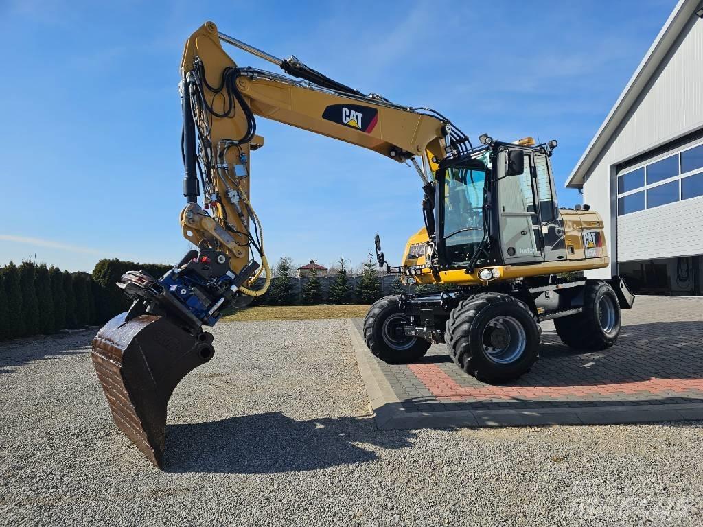 CAT M 313 D حفارات بعجل