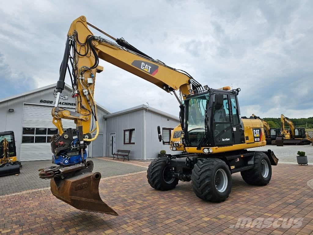 CAT M 313 D حفارات بعجل