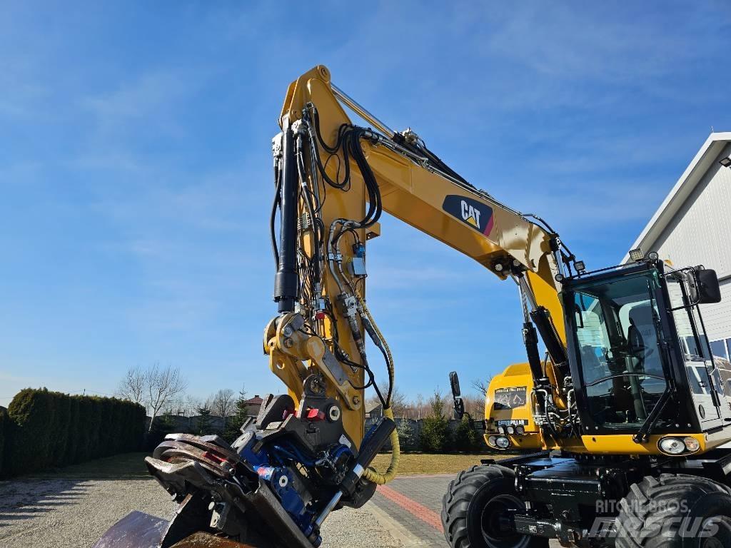 CAT M 313 D حفارات بعجل