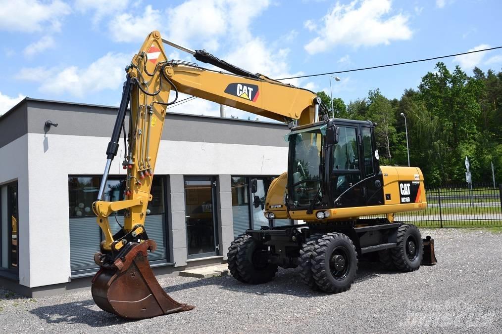 CAT M 316 D حفارات بعجل