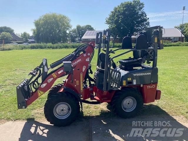 Weidemann 1140 لوادر وحفارات أمامية
