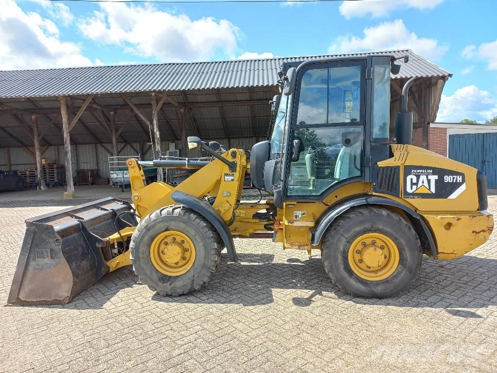 CAT 907 H لوادر بعجل