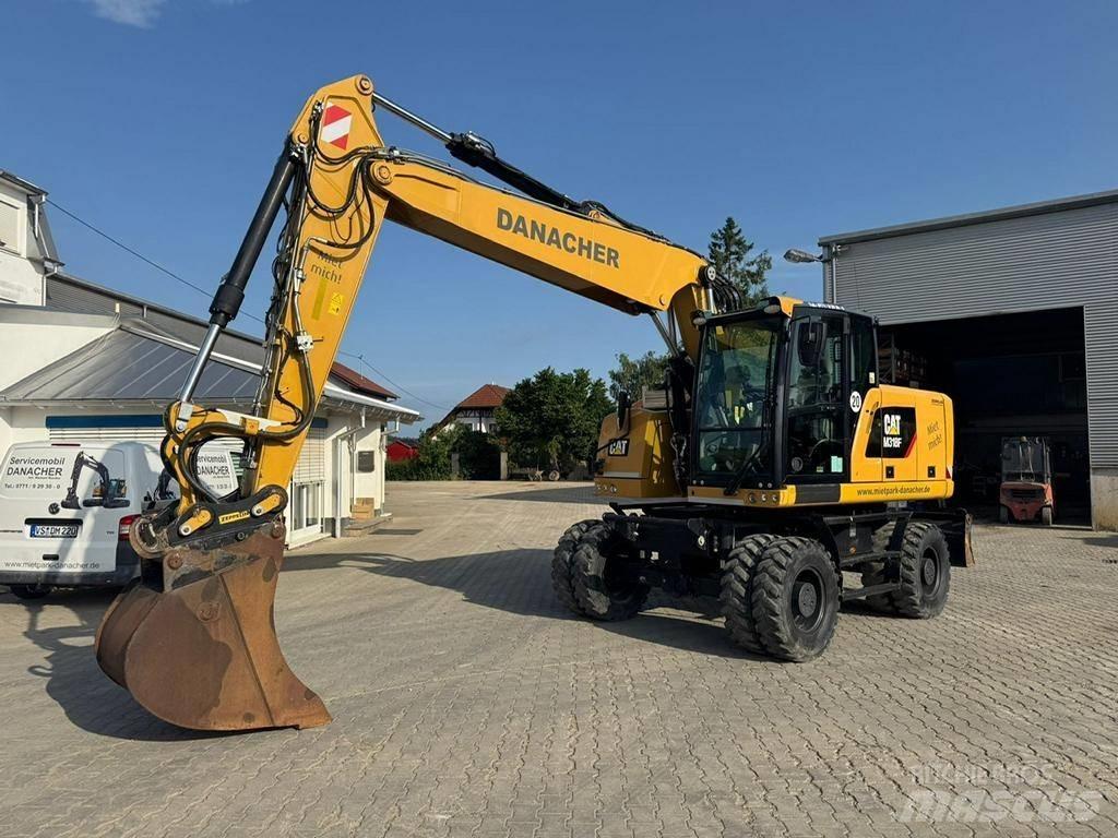 CAT M 318 F حفارات بعجل