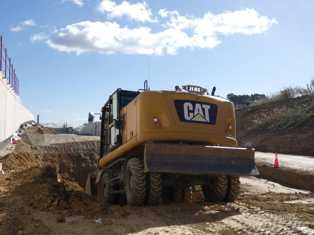 CAT M 318 F حفارات بعجل