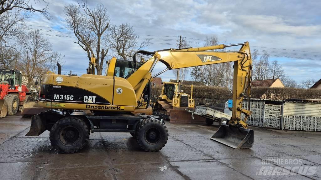 CAT M 315 C حفارات بعجل