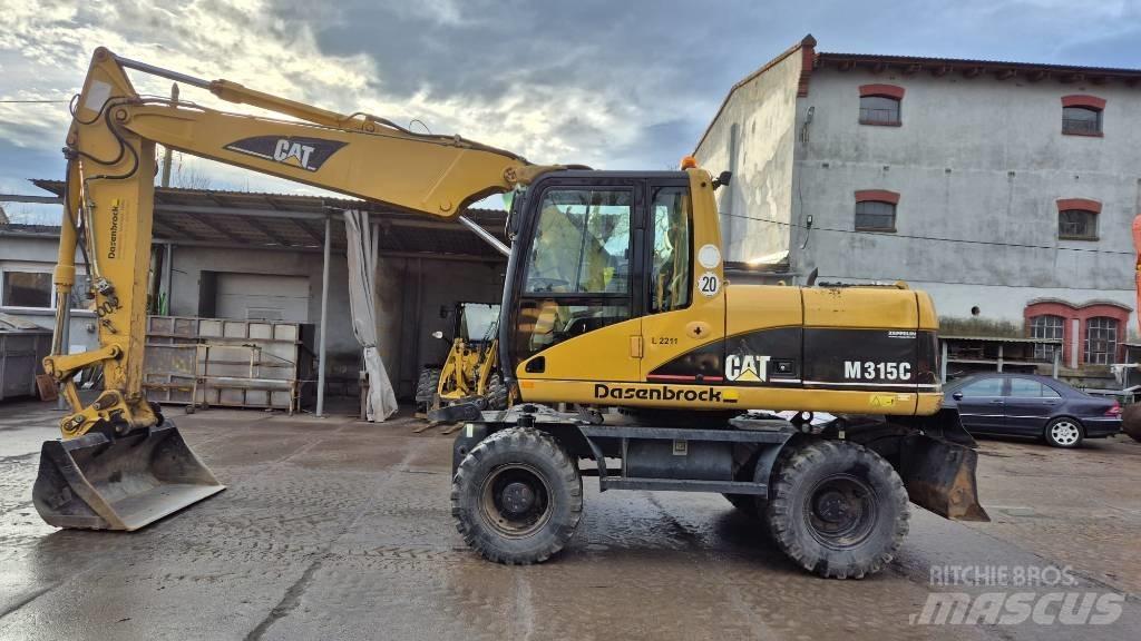 CAT M 315 C حفارات بعجل